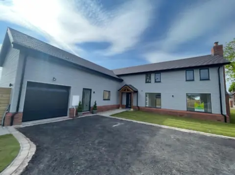 Pale cladding across a courtyard elevation — CG Cladding Solutions