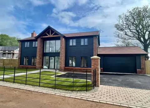 Cladding and a timber-framed entrance — CG Cladding Solutions